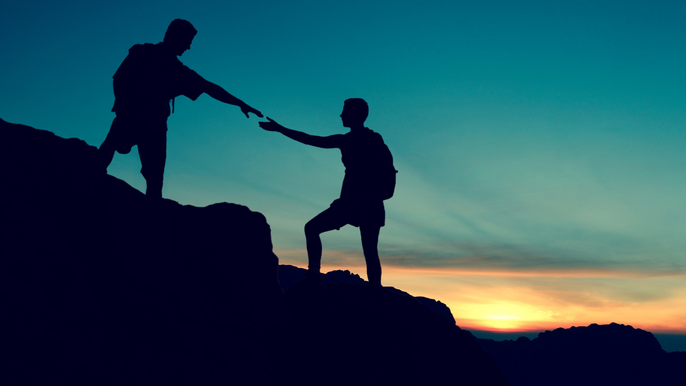 one hiker helping another