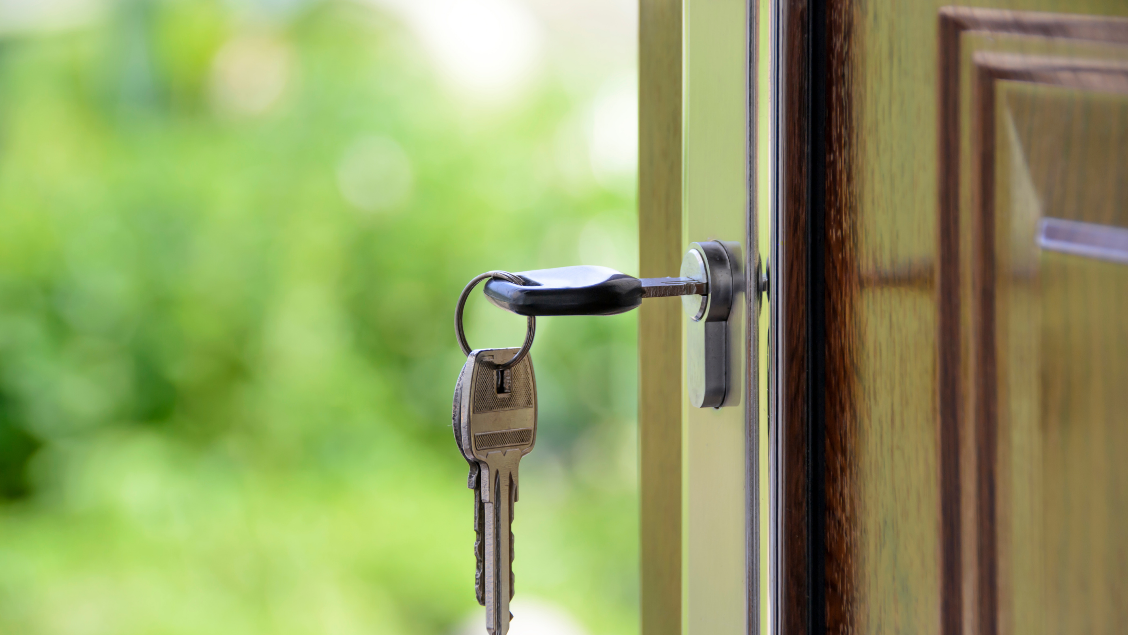 open door with key in lock