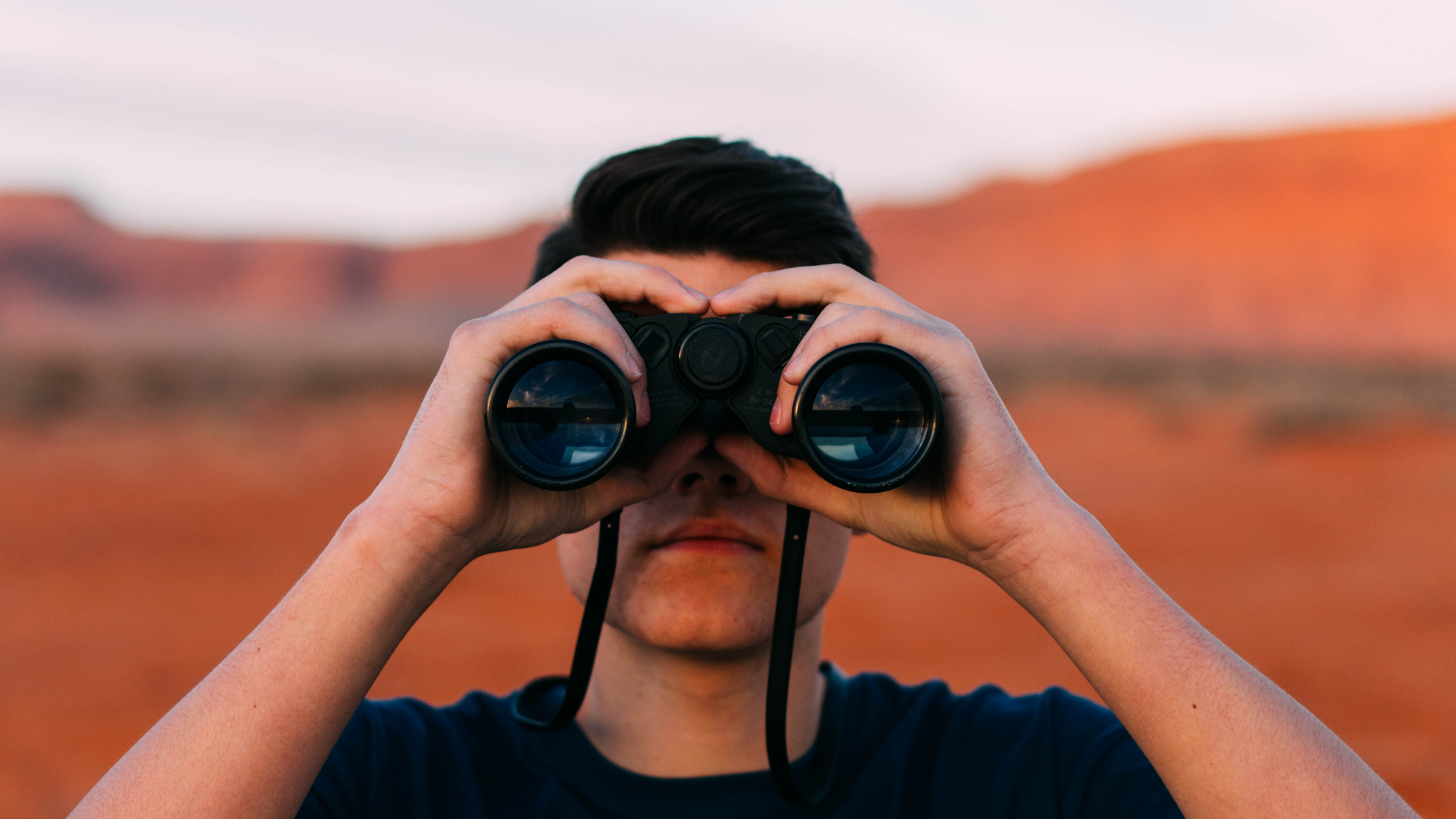 person with binoculars